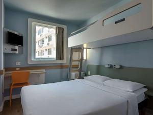 Кровать или кровати в номере ibis budget RJ Praia de Botafogo +37 фотографий