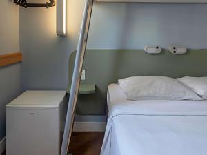 Кровать или кровати в номере ibis budget RJ Praia de Botafogo