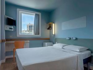 Кровать или кровати в номере ibis budget RJ Praia de Botafogo