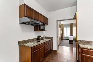 a kitchen with a sink and a counter top at Comfort Inn & Suites Kenosha-Pleasant Prairie in Kenosha