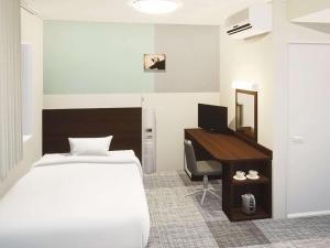 Säng eller sängar i ett rum på Comfort Hotel Kure