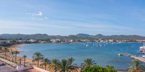 a view of a beach with boats in a harbor at Sunside Ibiza Studios - Only Adults- Formerly known as Central Park in San Antonio