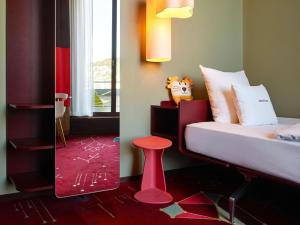 Postelja oz. postelje v sobi nastanitve 25hours Hotel Zürich West