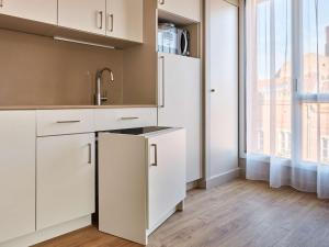 Kuchyň nebo kuchyňský kout v ubytování Aparthotel Adagio Original Toulouse Centre La Grave