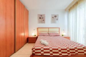 En eller flere senge i et værelse på Casa Puig Rom 40 Roses - Immo Barneda