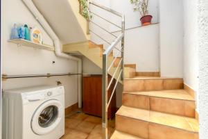 a laundry room with a washer and dryer at Casa Puig Rom 40 Roses - Immo Barneda in Roses