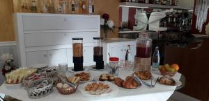 a table with a bunch of food on it at Hotel Tiffany in Ceriale