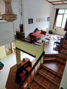 an overhead view of a living room with a bed at Villa KenDedes Garden in Batu