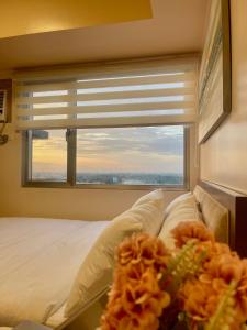 A bed or beds in a room at Classy Studio Unit at Aspira Towers