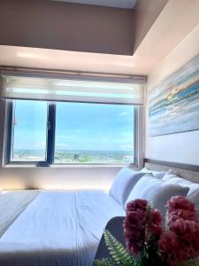 A bed or beds in a room at Classy Studio Unit at Aspira Towers
