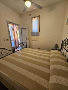 Cama ou camas em um quarto em Casa La Pelosa