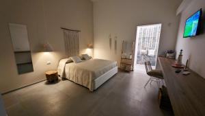 TV a/nebo společenská místnost v ubytování RoRà 1962 - Boho Chic Rooms Torre Lapillo