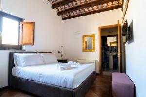 Postel nebo postele na pokoji v ubytování Villa Vittoria Hotel