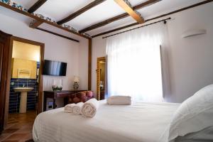 Postel nebo postele na pokoji v ubytování Villa Vittoria Hotel