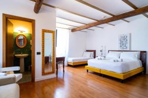 Postel nebo postele na pokoji v ubytování Villa Vittoria Hotel