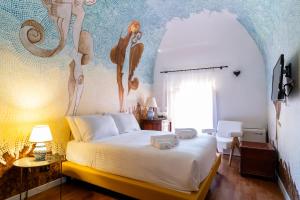 Postel nebo postele na pokoji v ubytování Villa Vittoria Hotel