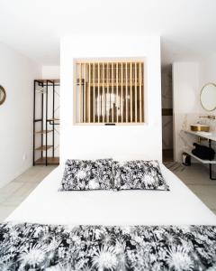 a bedroom with a black and white rug on the floor at Bordeaux cosy home in Bordeaux