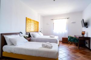 Postel nebo postele na pokoji v ubytování Villa Vittoria Hotel