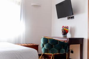 TV a/nebo společenská místnost v ubytování Villa Vittoria Hotel