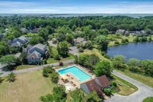 an aerial view of a home with a swimming pool at Spring Lake --- 20784 East Dr Unit 503 in Rehoboth Beach