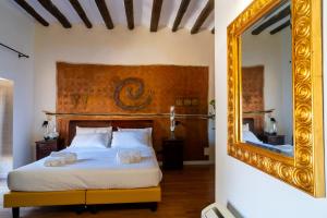 Postel nebo postele na pokoji v ubytování Villa Vittoria Hotel