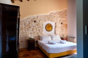 Postel nebo postele na pokoji v ubytování Villa Vittoria Hotel