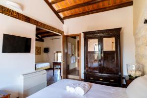 TV a/nebo společenská místnost v ubytování Villa Vittoria Hotel