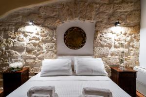 Postel nebo postele na pokoji v ubytování Villa Vittoria Hotel