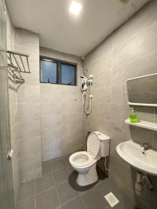 a bathroom with a toilet and a sink at Allure - Casa Kayangan Meru Ipoh by GOSWELL in Ipoh