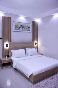 Postel nebo postele na pokoji v ubytování Hôtel Guest House Quatre Saisons