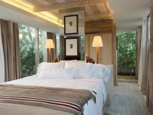 A bed or beds in a room at Kawung Villa