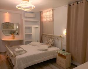 Ένα ή περισσότερα κρεβάτια σε δωμάτιο στο Relaxaki Apartment, Naxos town