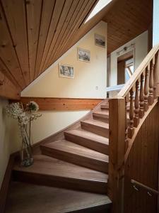 a staircase in a house with wooden ceilings at Ferienwohnung Hänel in Antonshöhe