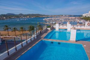 a view of the ocean from a hotel pool at Sunside Ibiza Studios - Only Adults- Formerly known as Central Park in San Antonio