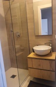 a bathroom with a sink and a glass shower at La Roja Grand apartement luxury 3 bedrooms in Ventimiglia +26 photos
