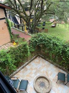 an overhead view of a patio with chairs and a tree at LaPianta in Monte Verde
