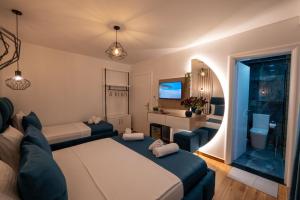 a living room with a bed and a couch at Crown HF Ksamil in Ksamil