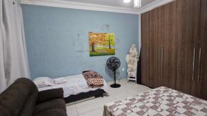 Ένα ή περισσότερα κρεβάτια σε δωμάτιο στο Casa Jardim