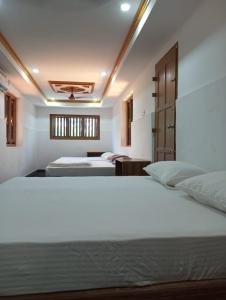 Katil atau katil-katil dalam bilik di Best Heritage Home
