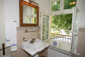 Koupelna v ubytování Aparthotel Stora Antis + 36 fotografií