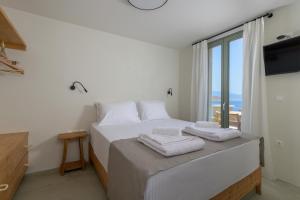 Postel nebo postele na pokoji v ubytování Onar Residences Chalki