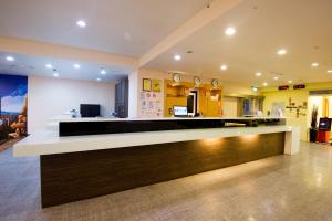 a lobby of a hospital with a reception counter at LIHO Hotel Hankou in Taipei