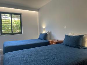 Ένα ή περισσότερα κρεβάτια σε δωμάτιο στο Apartamentos Honorio - Pool and Garden +181 φωτογραφίες