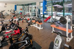 a gym with a bunch of bikes in a room at Bel Horizon in Le Chambon-sur-Lignon