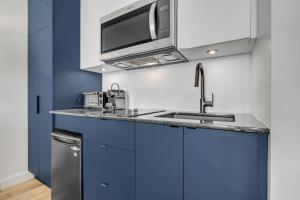 Η κουζίνα ή μικρή κουζίνα στο INITIAL - DISTRICT - Centre-Ville de Québec