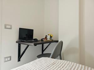 a desk with a laptop and a computer on it at Grey House 5 100mt dal mare in Tortoreto Lido