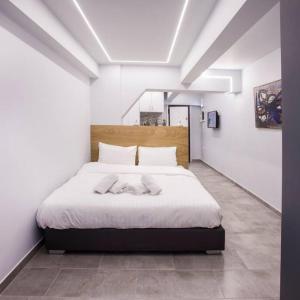 מיטה או מיטות בחדר ב-Exclusive New Modern Apartment at Syntagma Square