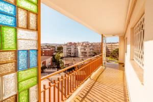 a balcony with a view of a city at Inspira by Unik Vacation in Torredembarra