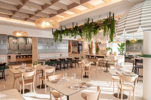 a rendering of a restaurant with tables and chairs at Hotel Estense in Gatteo a Mare +242 photos