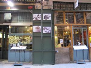 a store front with green doors and windows at Olles Apartment in Barcelona